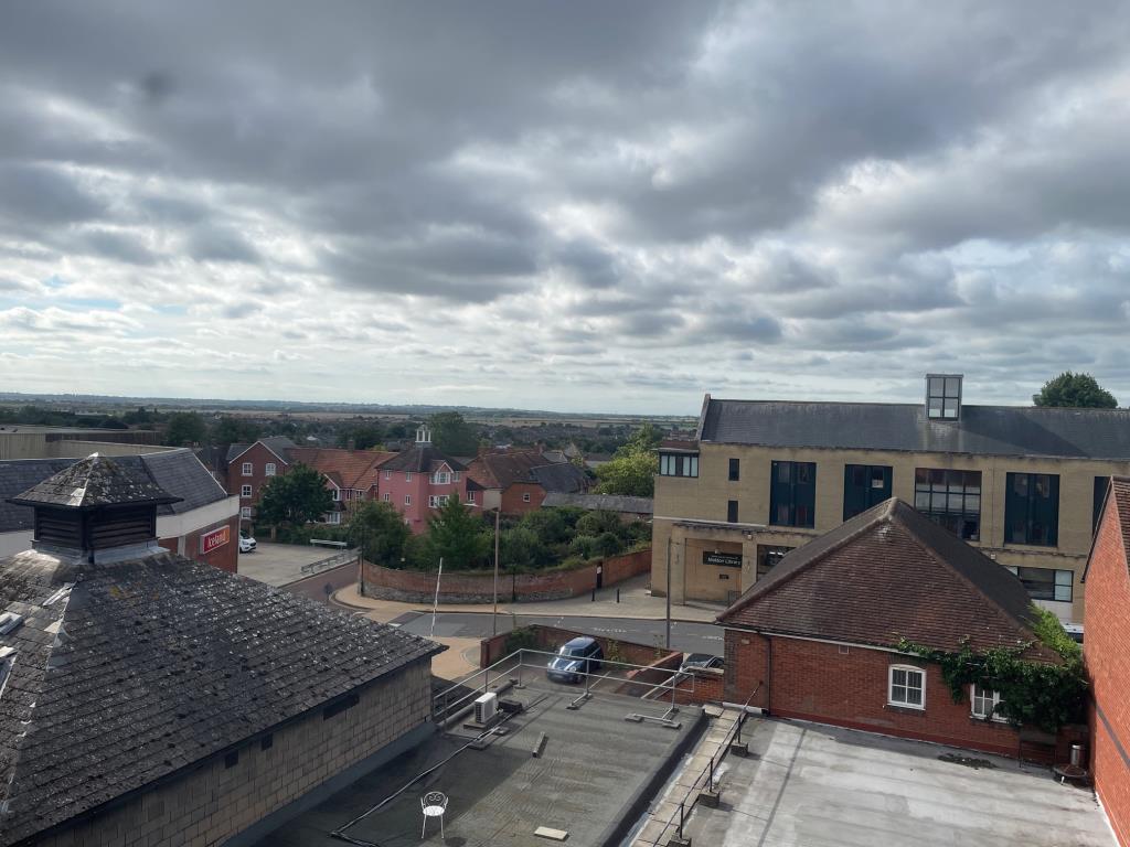Lot: 90 - VACANT TOP FLOOR FLAT WITH VIEWS OVER SURROUNDING AREA - view from the kitchen window to the rear